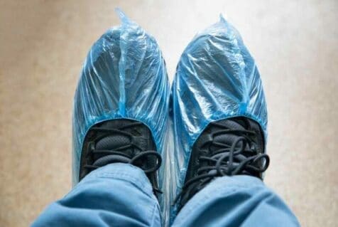 Workers boots in medical, plastic covers